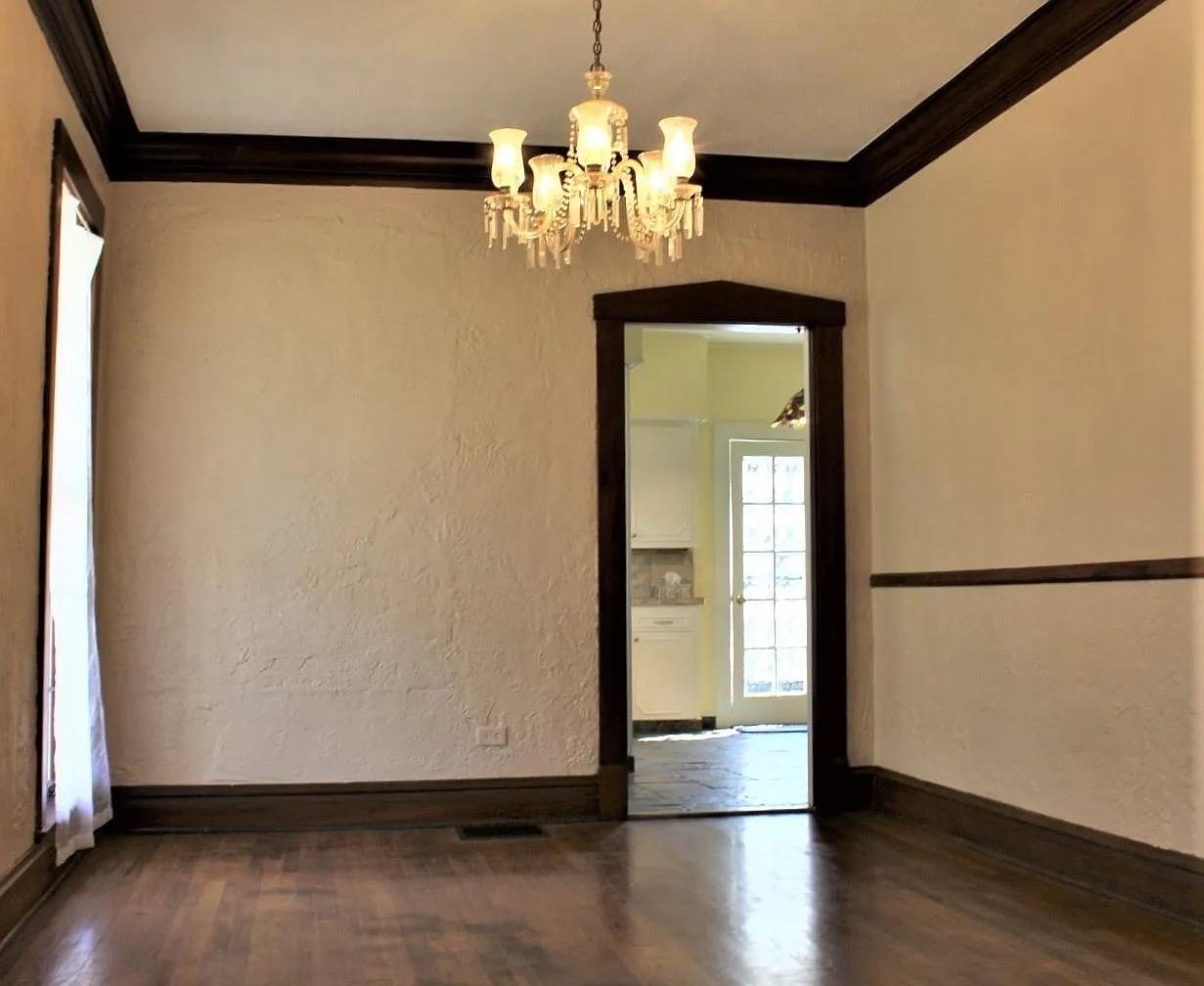 230 Lake Drive Ripley, TN 38063 - Photo 11 of 24 a view of a hallway with wooden floor and chandelier