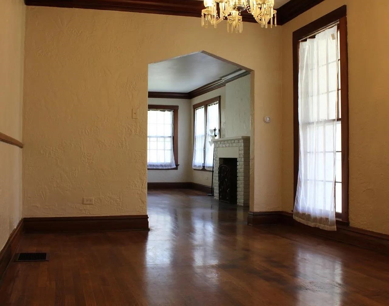 230 Lake Drive Ripley, TN 38063 - Photo 12 of 24 an empty room with wooden floor and windows