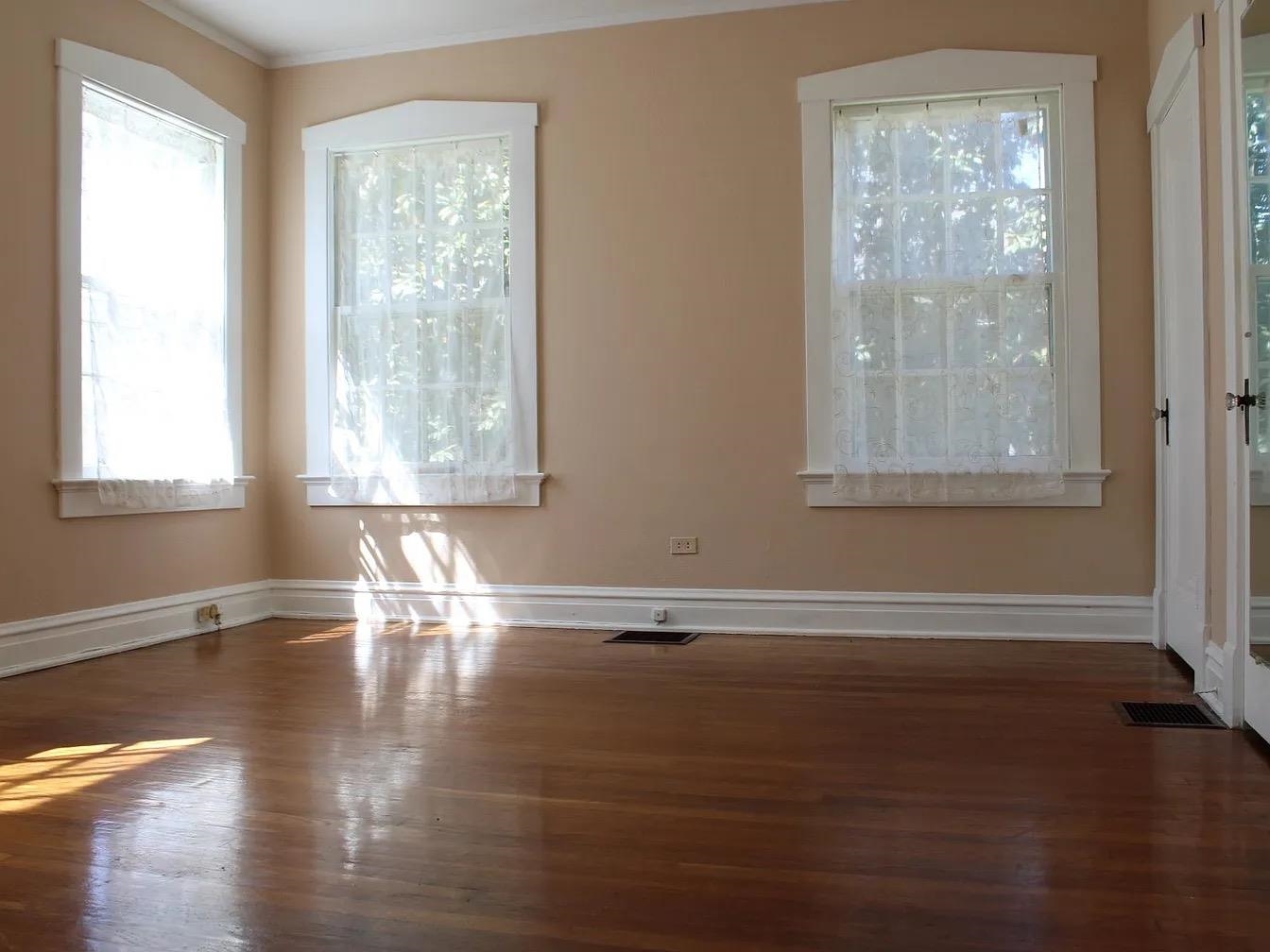 230 Lake Drive Ripley, TN 38063 - Photo 14 of 24 a view of an empty room with wooden floor and a window