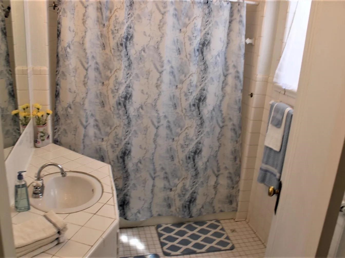 230 Lake Drive Ripley, TN 38063 - Photo 17 of 24 a bathroom with a sink toilet and shower