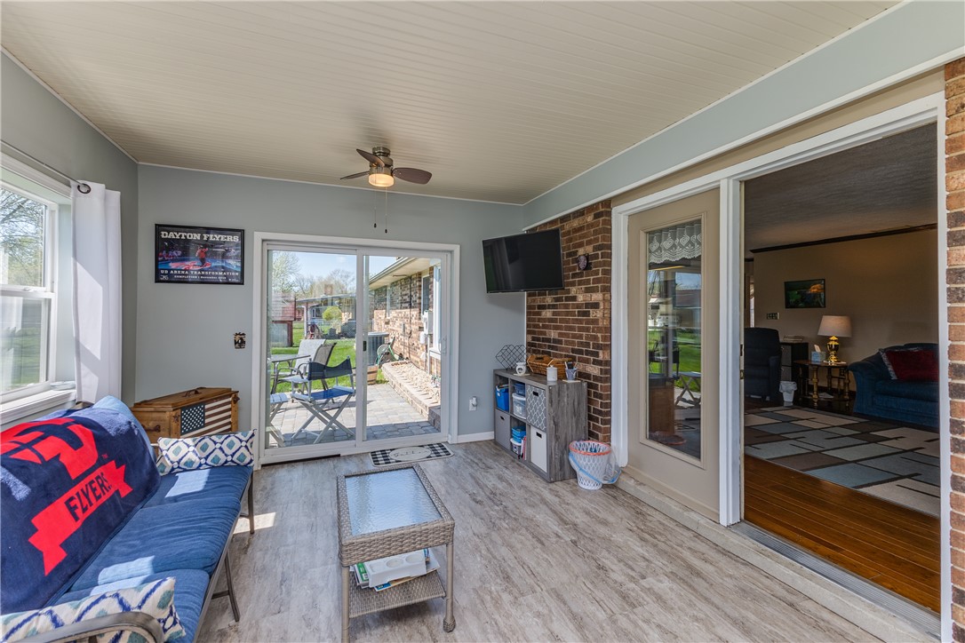 4210 Pleasanton Road Englewood, OH 45322 - Photo 16 of 34 Enjoy the outdoor breeze in this bright and airy sunroom, perfect for relaxation.