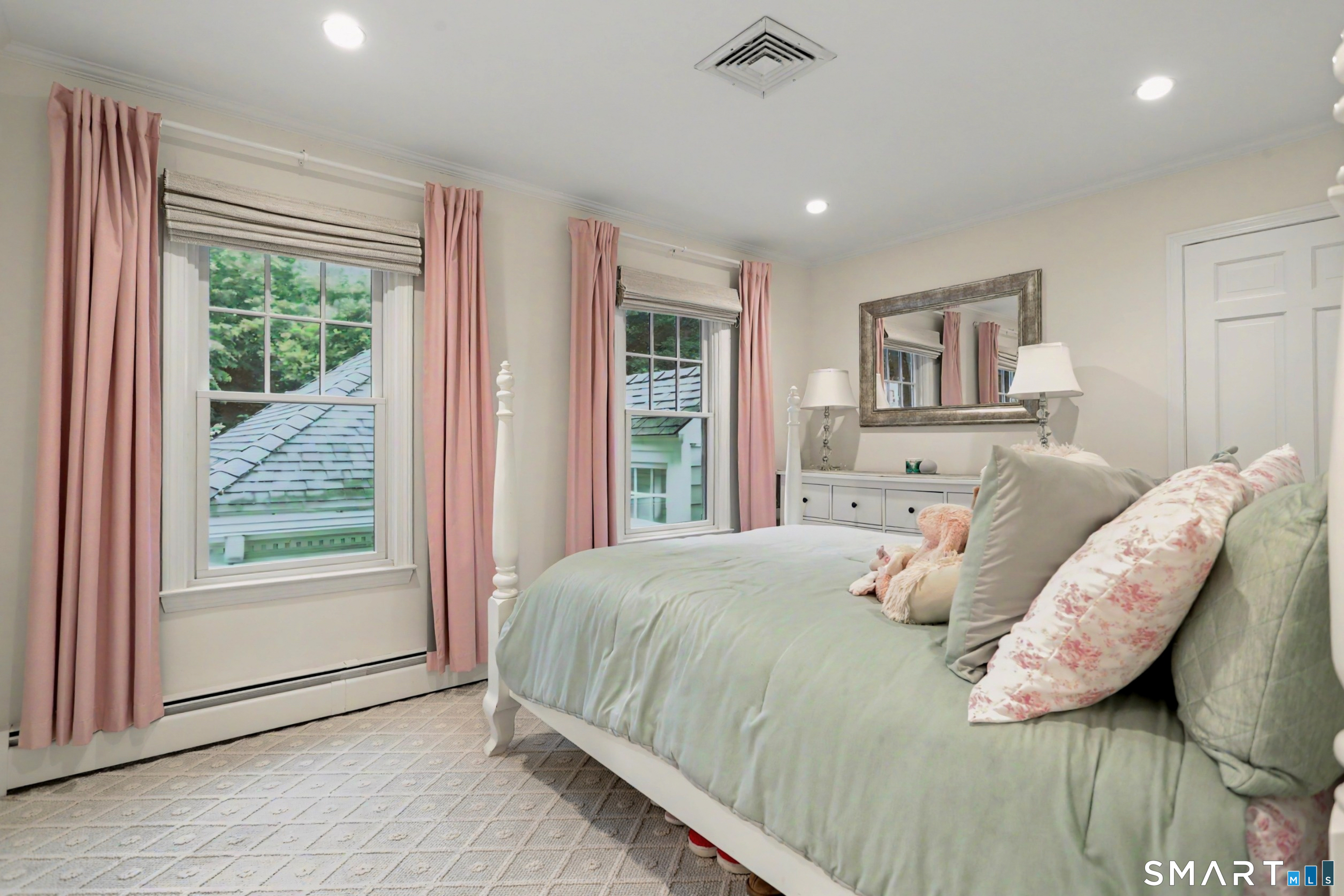 108 Logan Road New Canaan, CT 06840 - Photo 28 of 40 a large bedroom with a bed and a large window