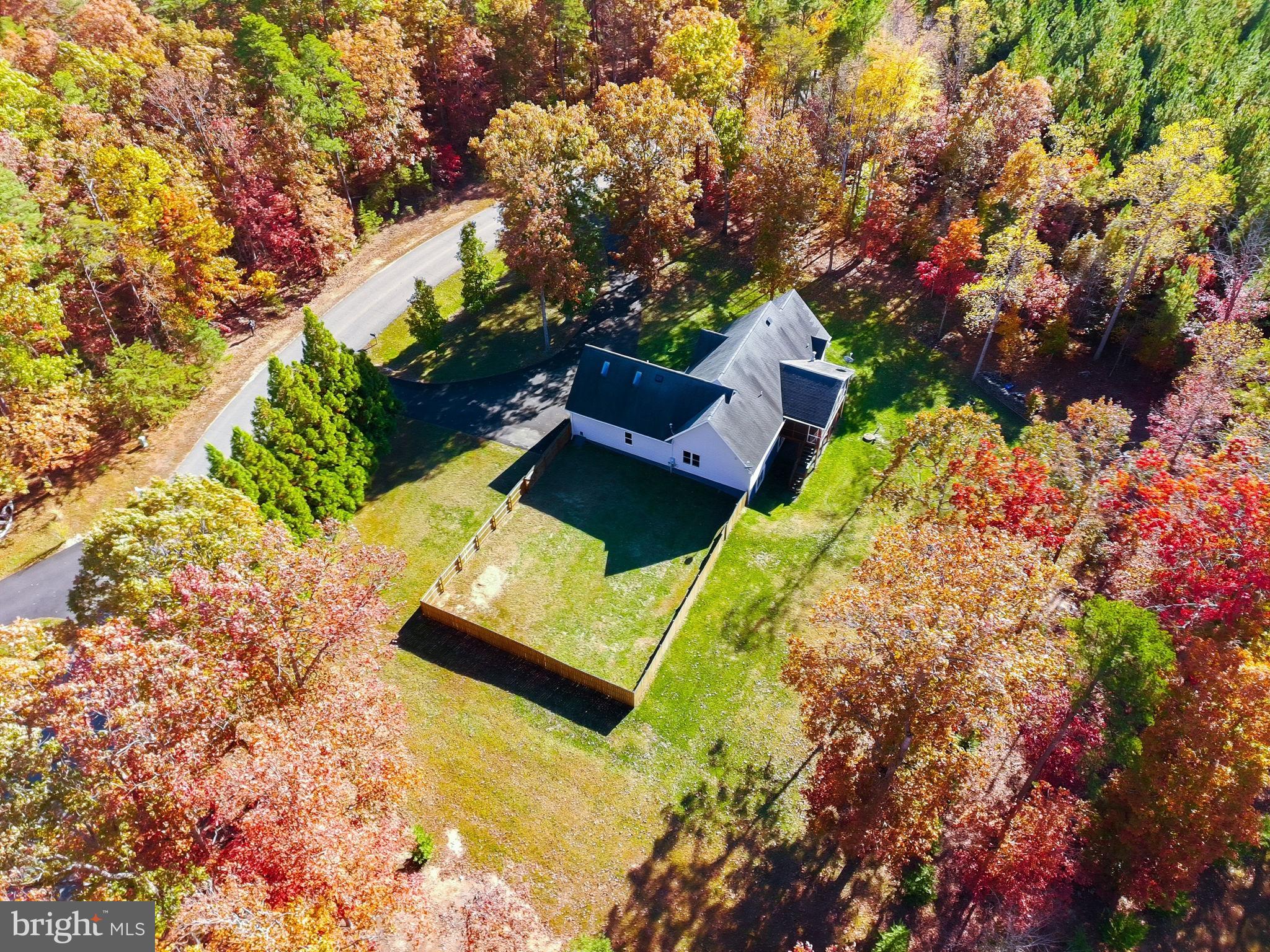 1923 Hensley Road Mineral, VA 23117 - Photo 3 of 62 an aerial view of a house with a yard swimming pool a patio and lake view