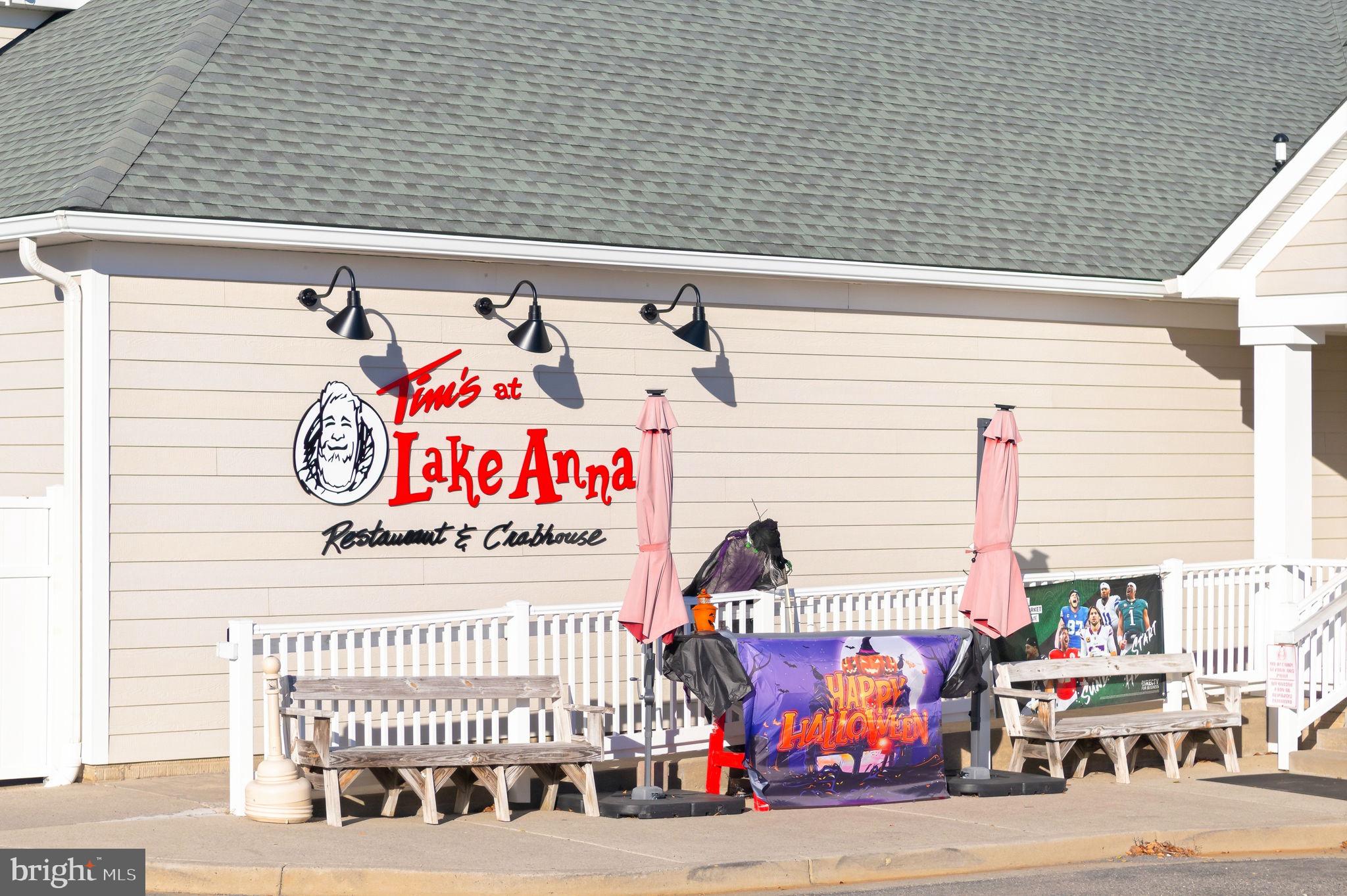 1923 Hensley Road Mineral, VA 23117 - Photo 45 of 62 a street sign on a brick wall with building in the background