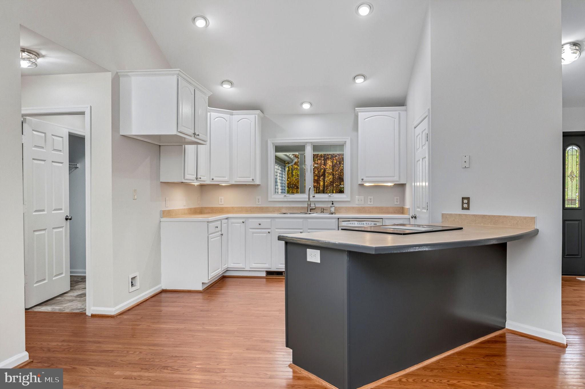 1923 Hensley Road Mineral, VA 23117 - Photo 9 of 62 a kitchen with stainless steel appliances granite countertop a sink stove and refrigerator