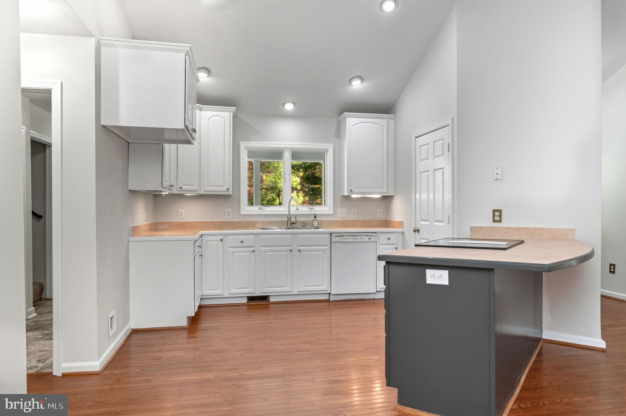 1923 Hensley Road Mineral, VA 23117 - Photo 10 of 62 a kitchen with white cabinets appliances and a sink
