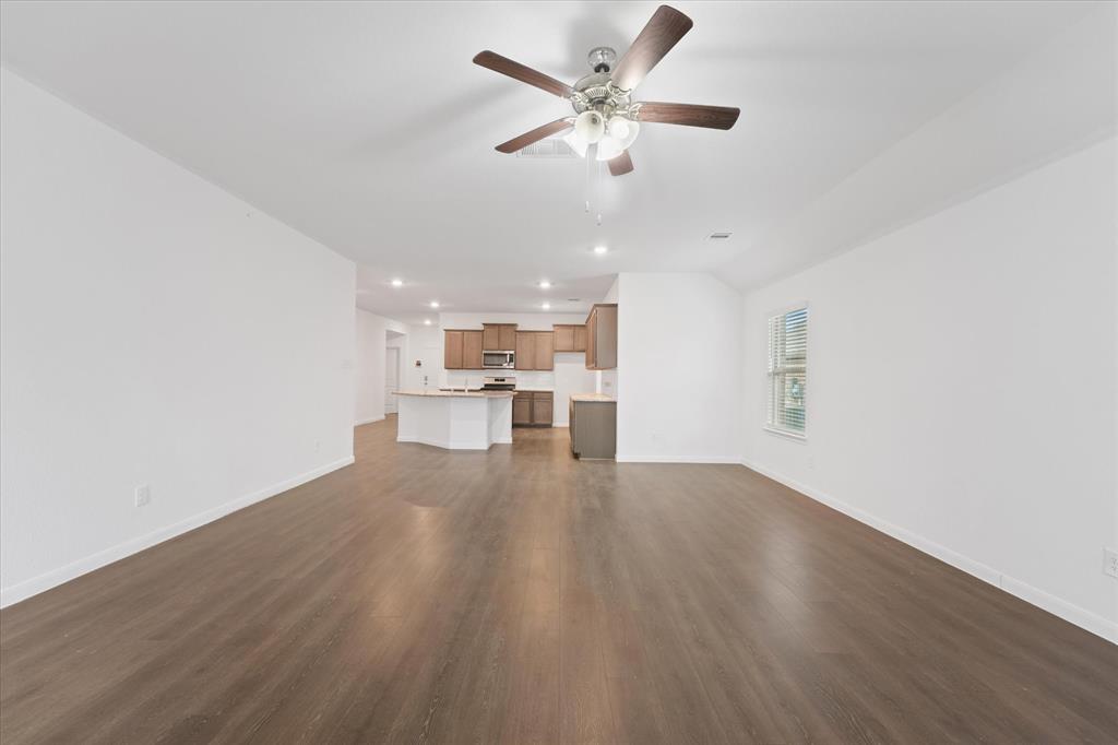 605 Spur Ridge Princeton, TX 75407 - Photo 30 of 30 a view of a kitchen with a sink and a refrigerator