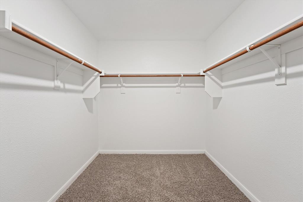 605 Spur Ridge Princeton, TX 75407 - Photo 16 of 30 a view of a room with racks on the wall