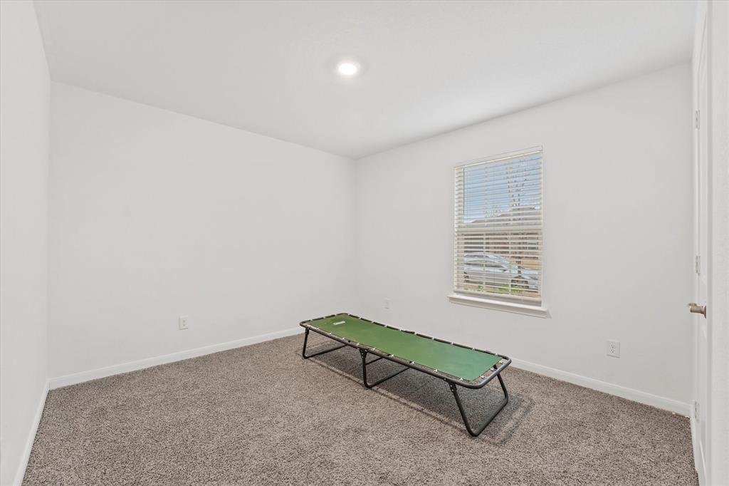 605 Spur Ridge Princeton, TX 75407 - Photo 17 of 30 a living room with furniture and a window