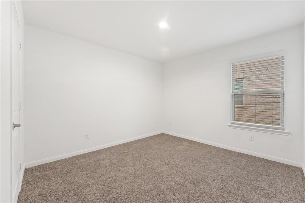 605 Spur Ridge Princeton, TX 75407 - Photo 20 of 30 an empty room with a window