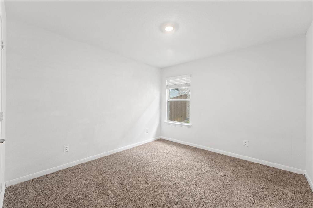 605 Spur Ridge Princeton, TX 75407 - Photo 22 of 30 a view of an empty room and a window