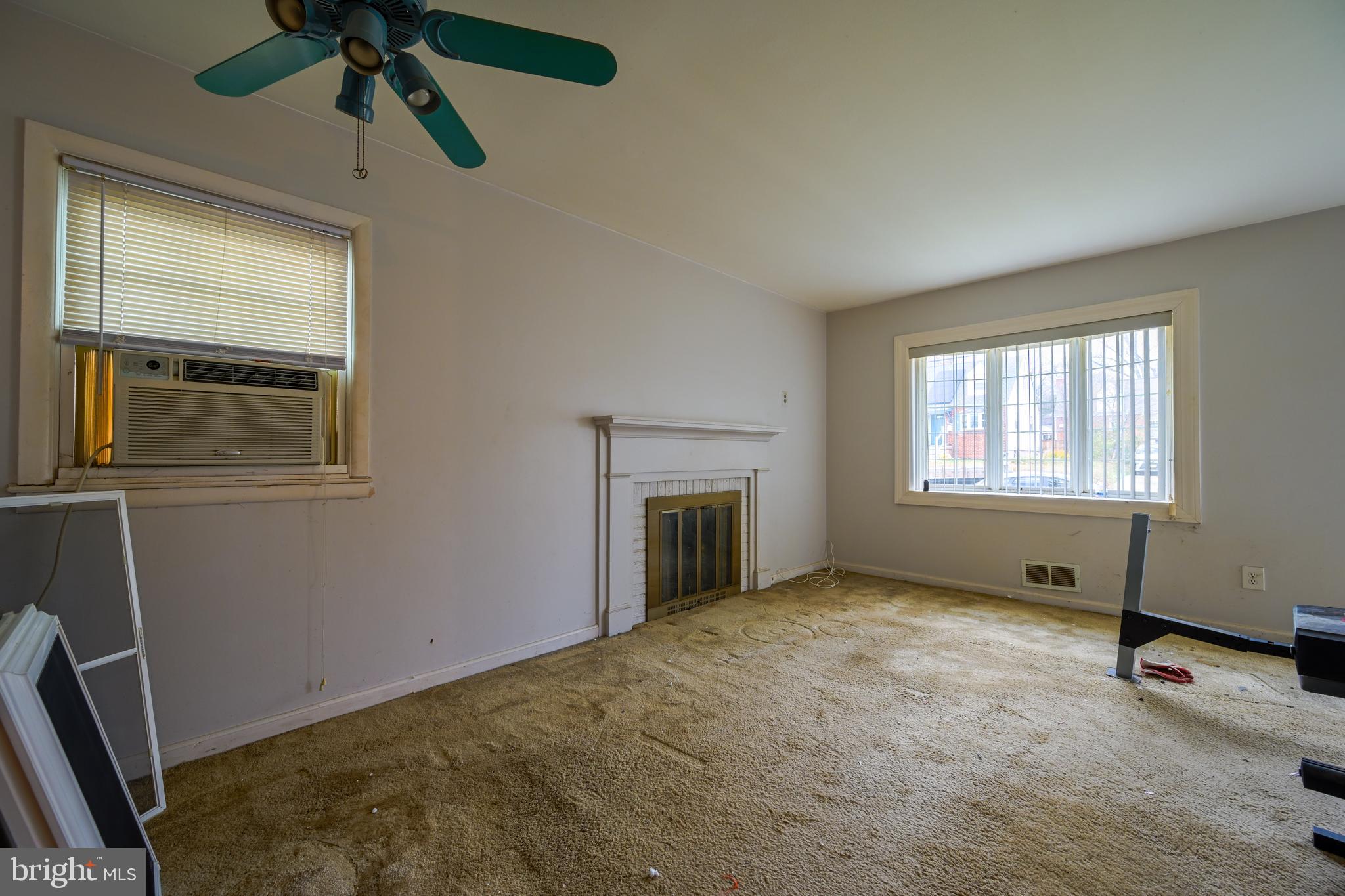 1518 Gridley Lane Silver Spring, MD 20902 - Photo 2 of 7 a view of empty room with window and fireplace
