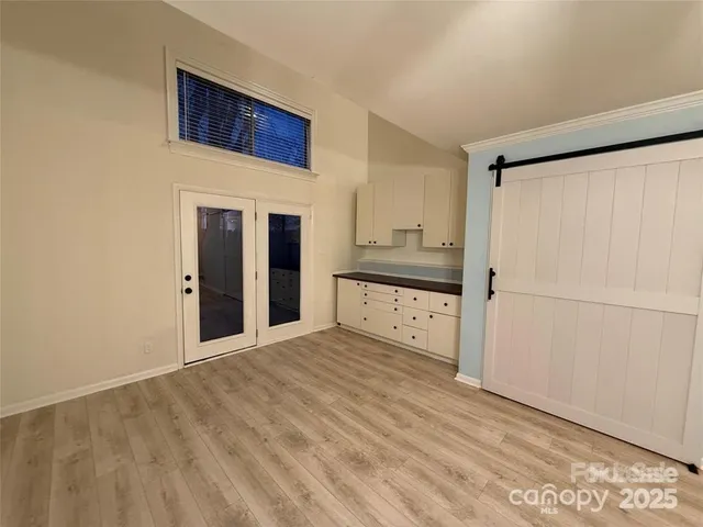 a view of a kitchen with a sink and cabinet