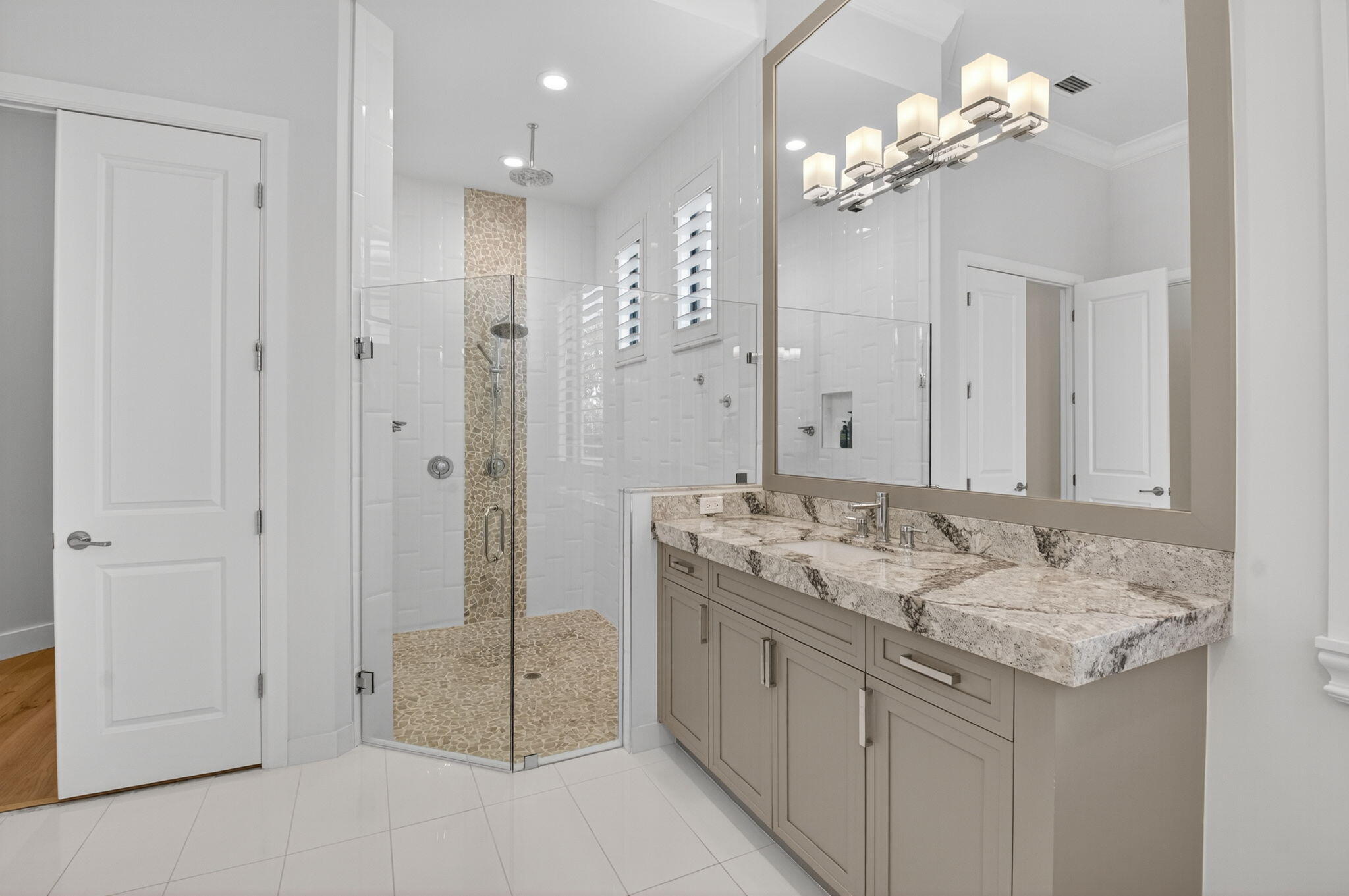 9331 Grand Prix Lane Boynton Beach, FL 33472 - Photo 29 of 96 a bathroom with a granite countertop sink a toilet and a mirror