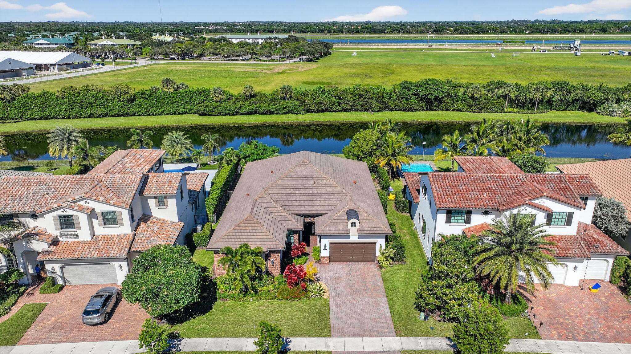 9331 Grand Prix Lane Boynton Beach, FL 33472 - Photo 53 of 96 an aerial view of a house with a lake view and a mountain view