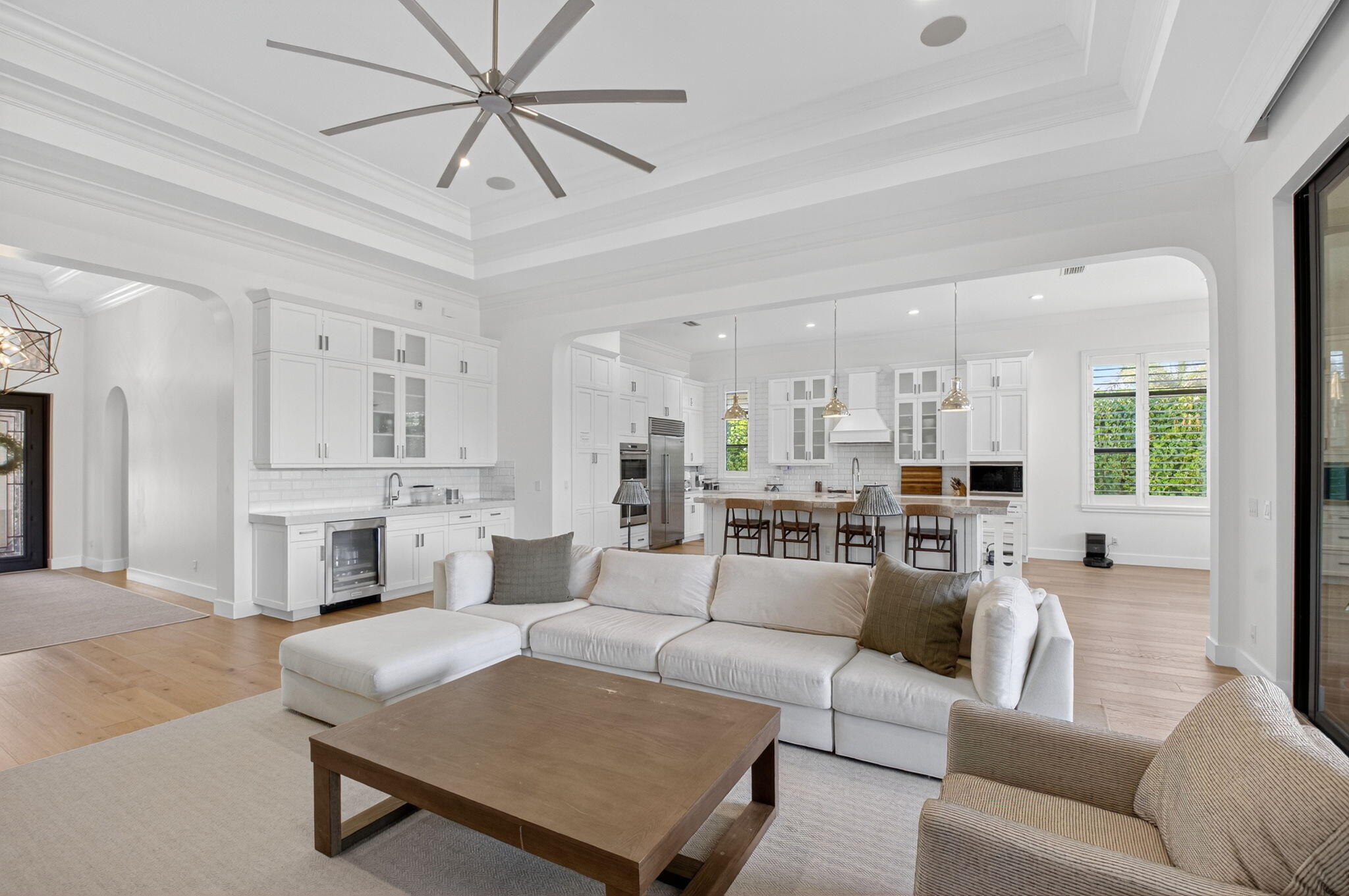 9331 Grand Prix Lane Boynton Beach, FL 33472 - Photo 7 of 96 a living room with furniture kitchen view and a chandelier