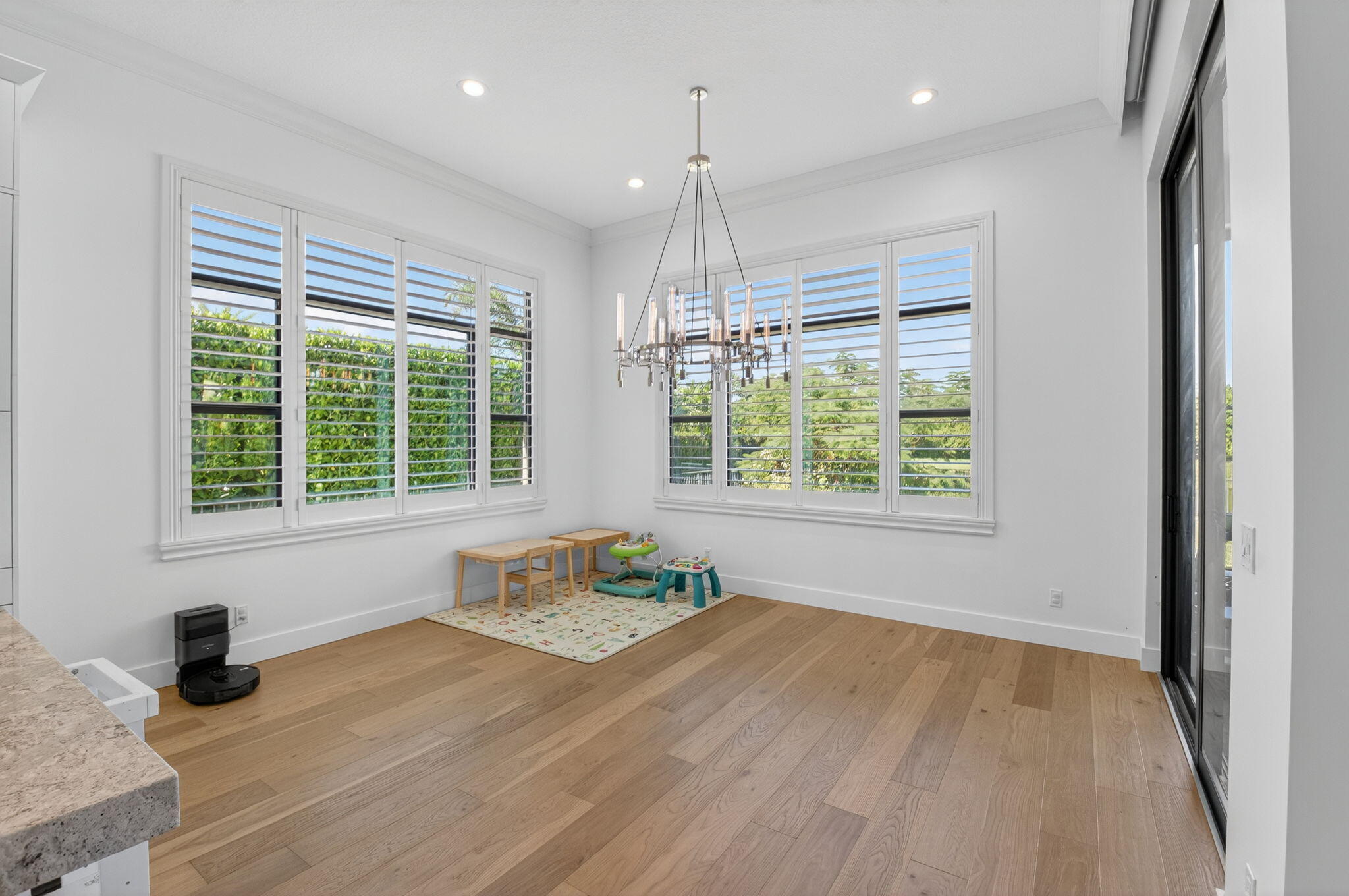 9331 Grand Prix Lane Boynton Beach, FL 33472 - Photo 10 of 96 a view of an empty room with a window and wooden floor