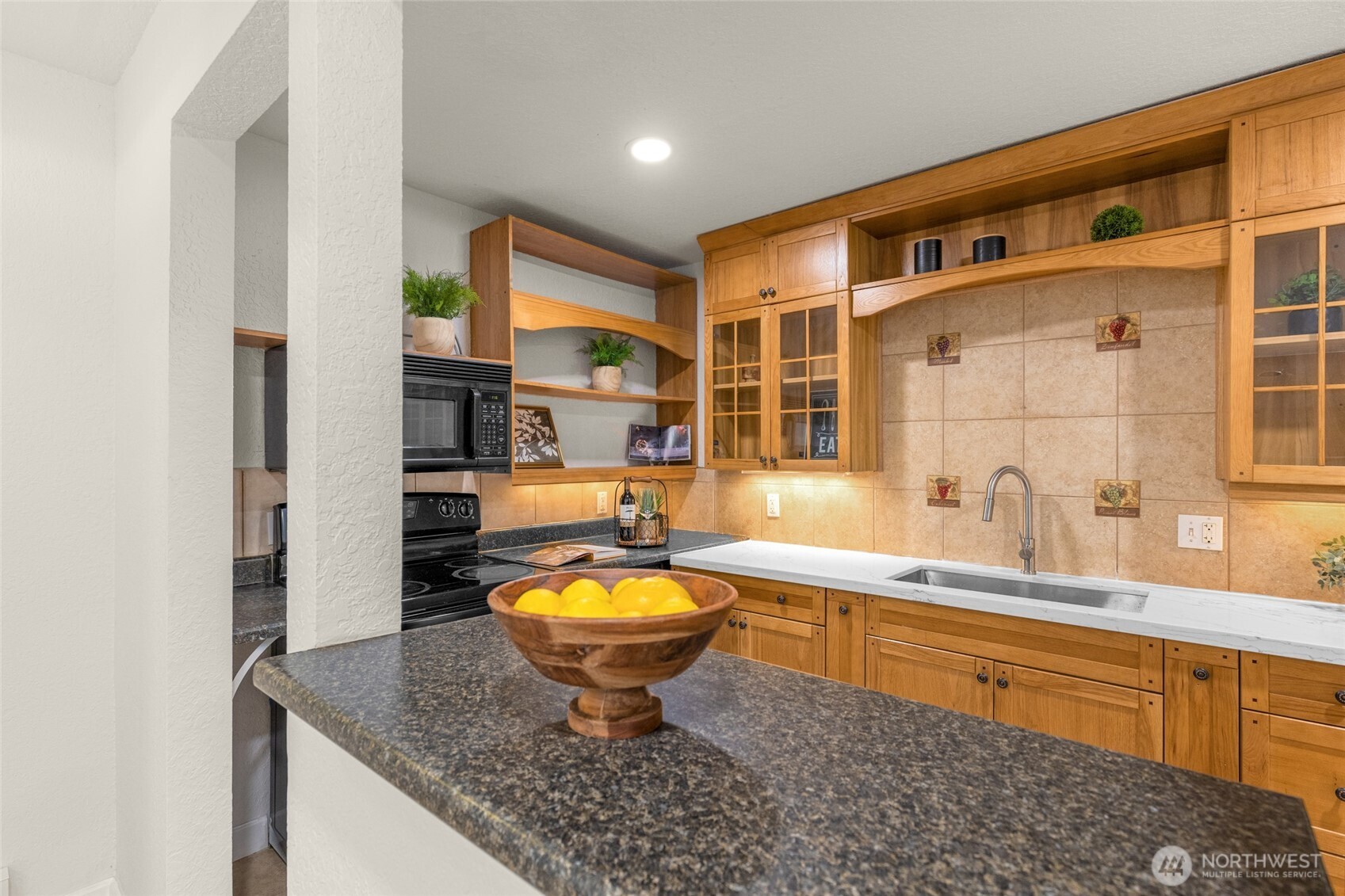 13626 Northeast 7th Street, Unit F10 Bellevue, WA 98005 - Photo 8 of 31 a large bathroom with sink a mirror a bathtub and shower