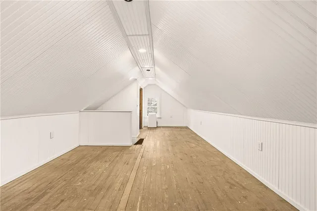 a view of a big room with stairs and wooden floor