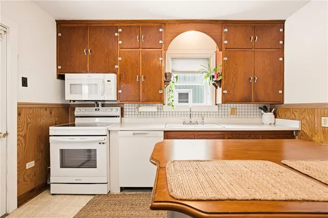 a kitchen with a sink and a fireplace