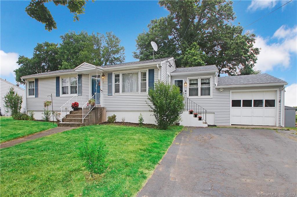 a view of a house with a backyard