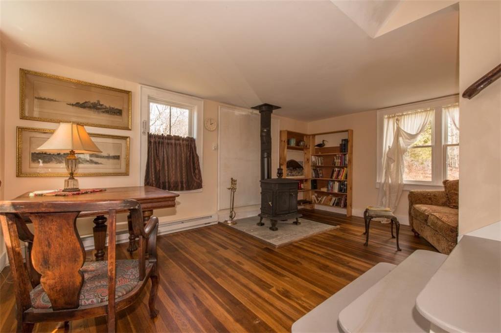 674 Wiscasset Road Boothbay, ME 04537 - Photo 8 of 19 The living room, with built-ins,...