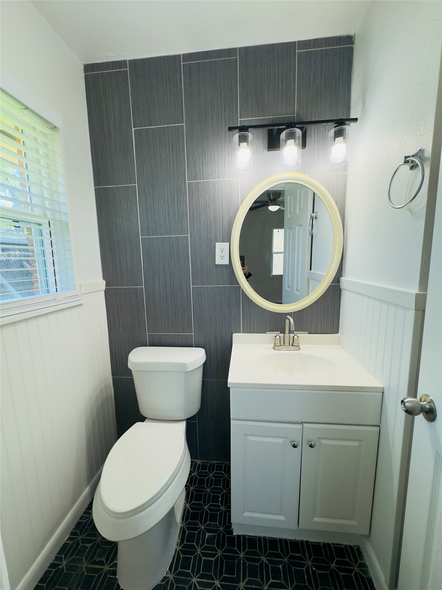 8733 Lugary Drive Houston, TX 77074 - Photo 18 of 30 a bathroom with a toilet sink and mirror
