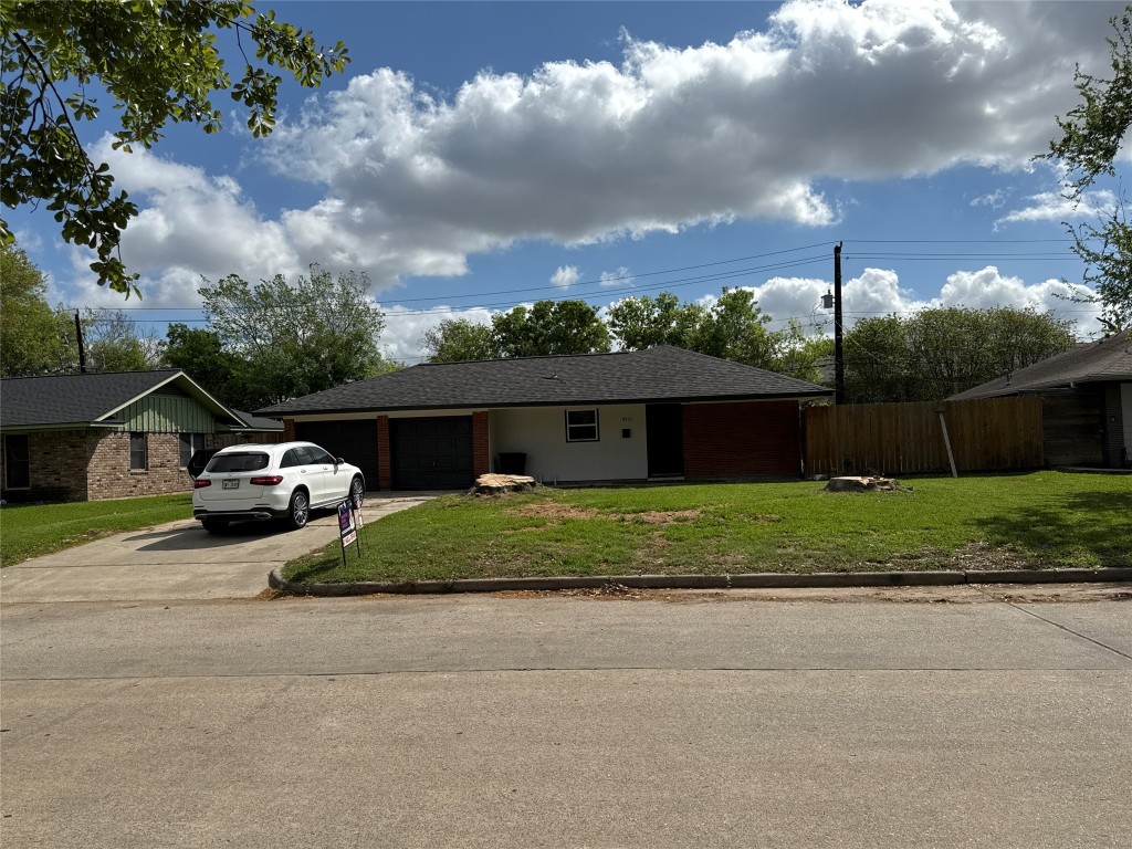 8733 Lugary Drive Houston, TX 77074 - Photo 2 of 30 a car parked on the side of the road
