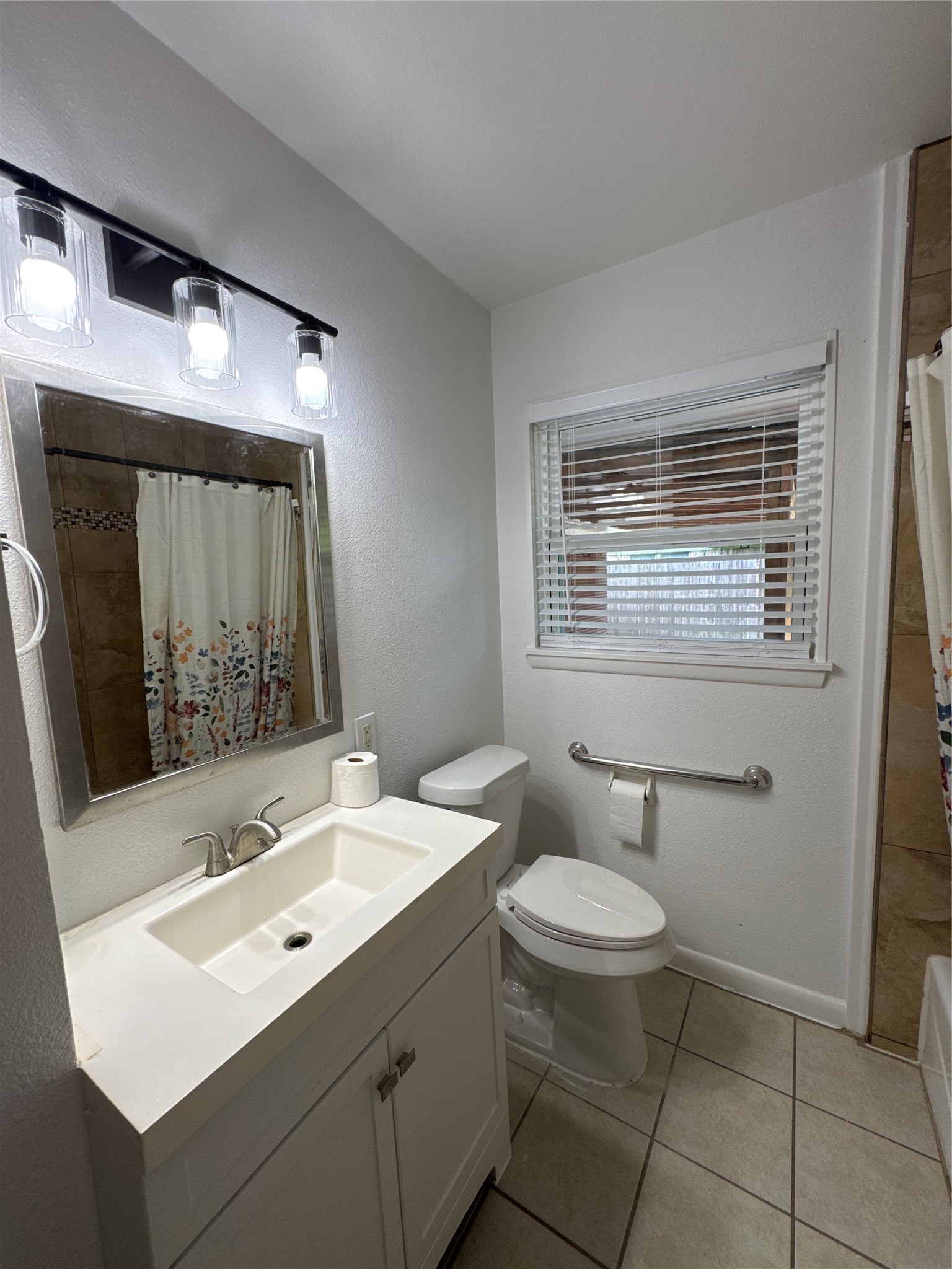 8733 Lugary Drive Houston, TX 77074 - Photo 24 of 30 a bathroom with a sink toilet and mirror