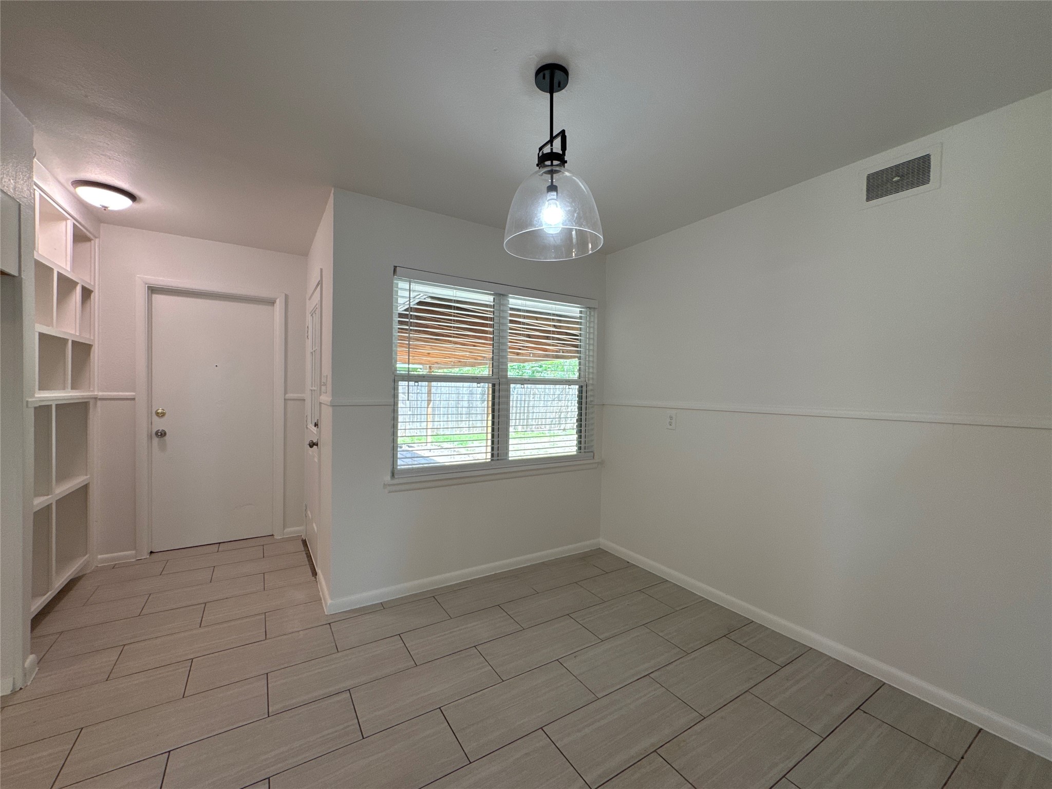 8733 Lugary Drive Houston, TX 77074 - Photo 5 of 30 an empty room with a empty space and a window