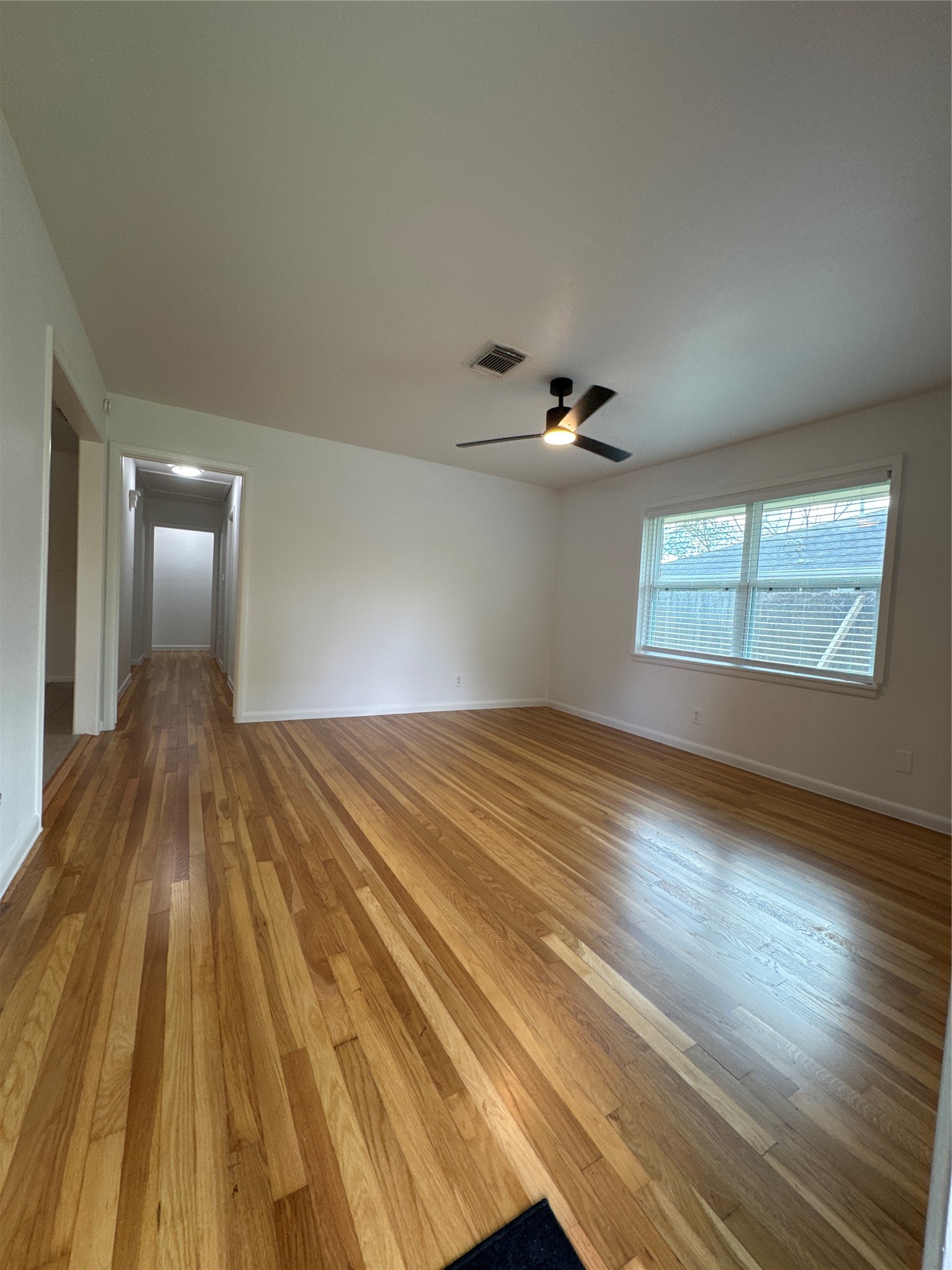8733 Lugary Drive Houston, TX 77074 - Photo 8 of 30 a view of empty room with wooden floor