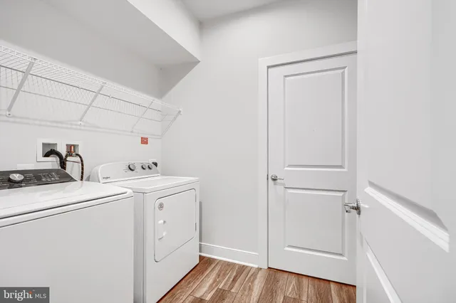 a view of storage and utility room with washer and dryer