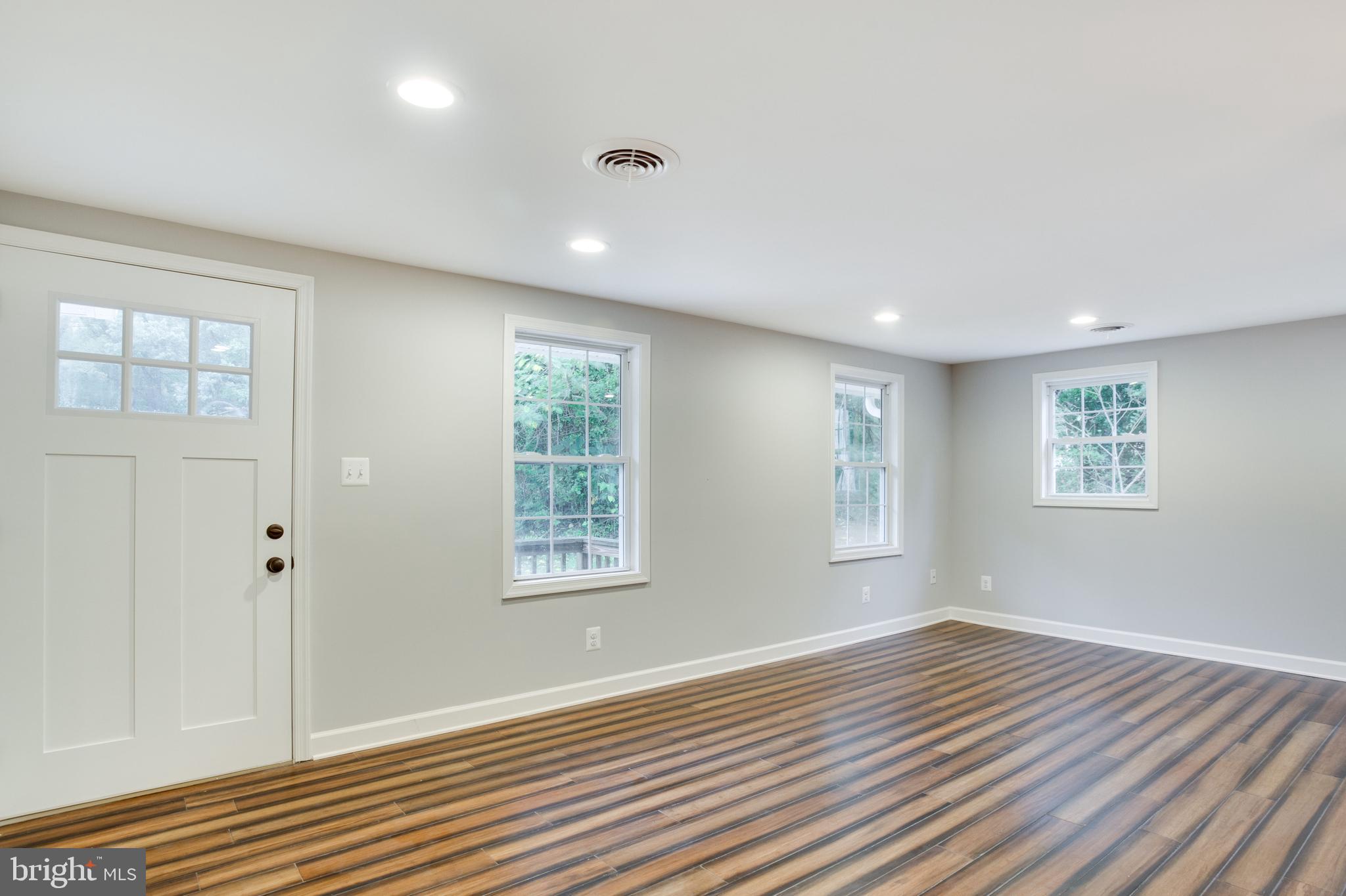 5601 Cherry Hill Road Huntingtown, MD 20639 - Photo 37 of 37 a view of an empty room with wooden floor and a window