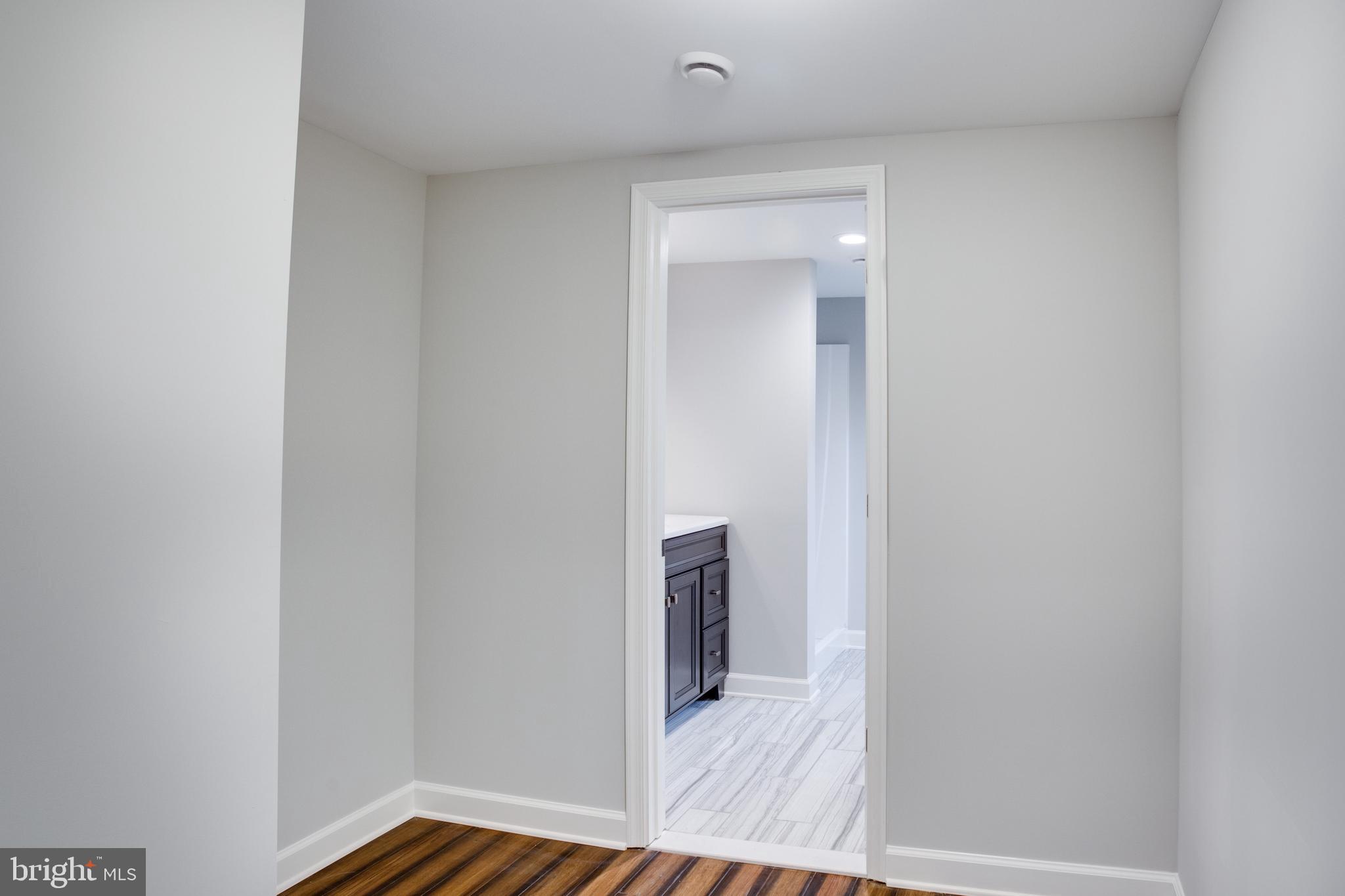 5601 Cherry Hill Road Huntingtown, MD 20639 - Photo 15 of 37 a view of a hallway with wooden floor