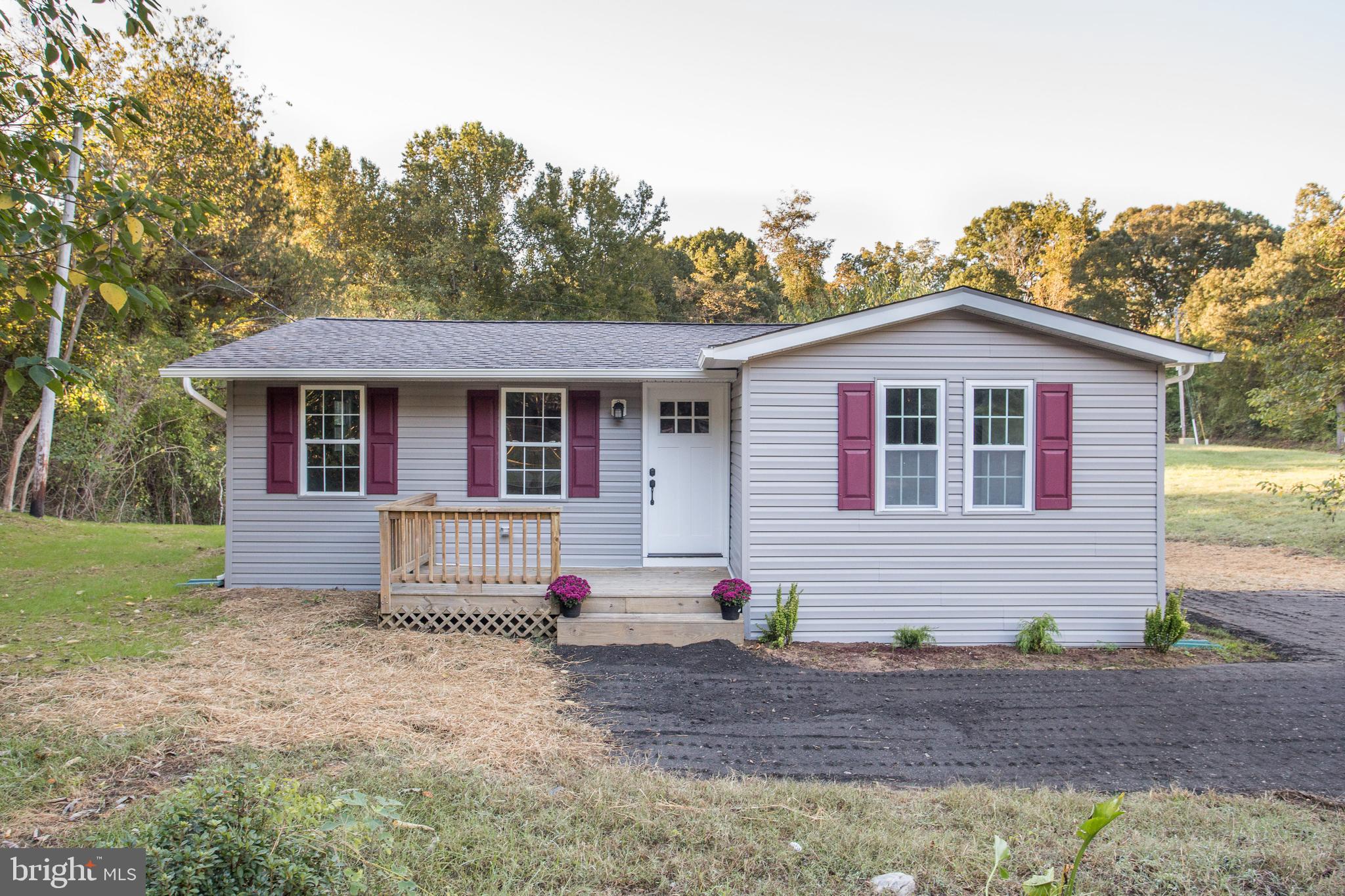 5601 Cherry Hill Road Huntingtown, MD 20639 - Photo 29 of 37 a front view of a house with garden
