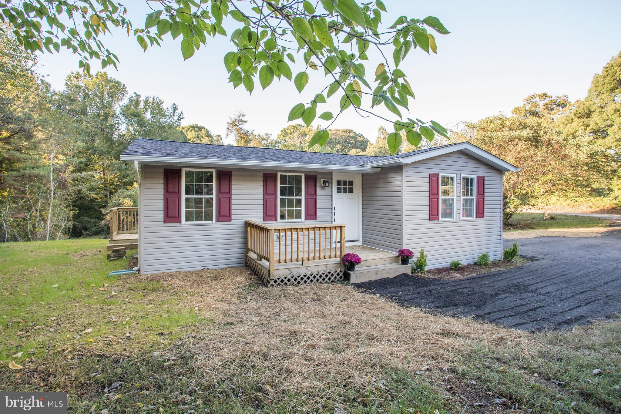5601 Cherry Hill Road Huntingtown, MD 20639 - Photo 30 of 37 a view of a house with a backyard