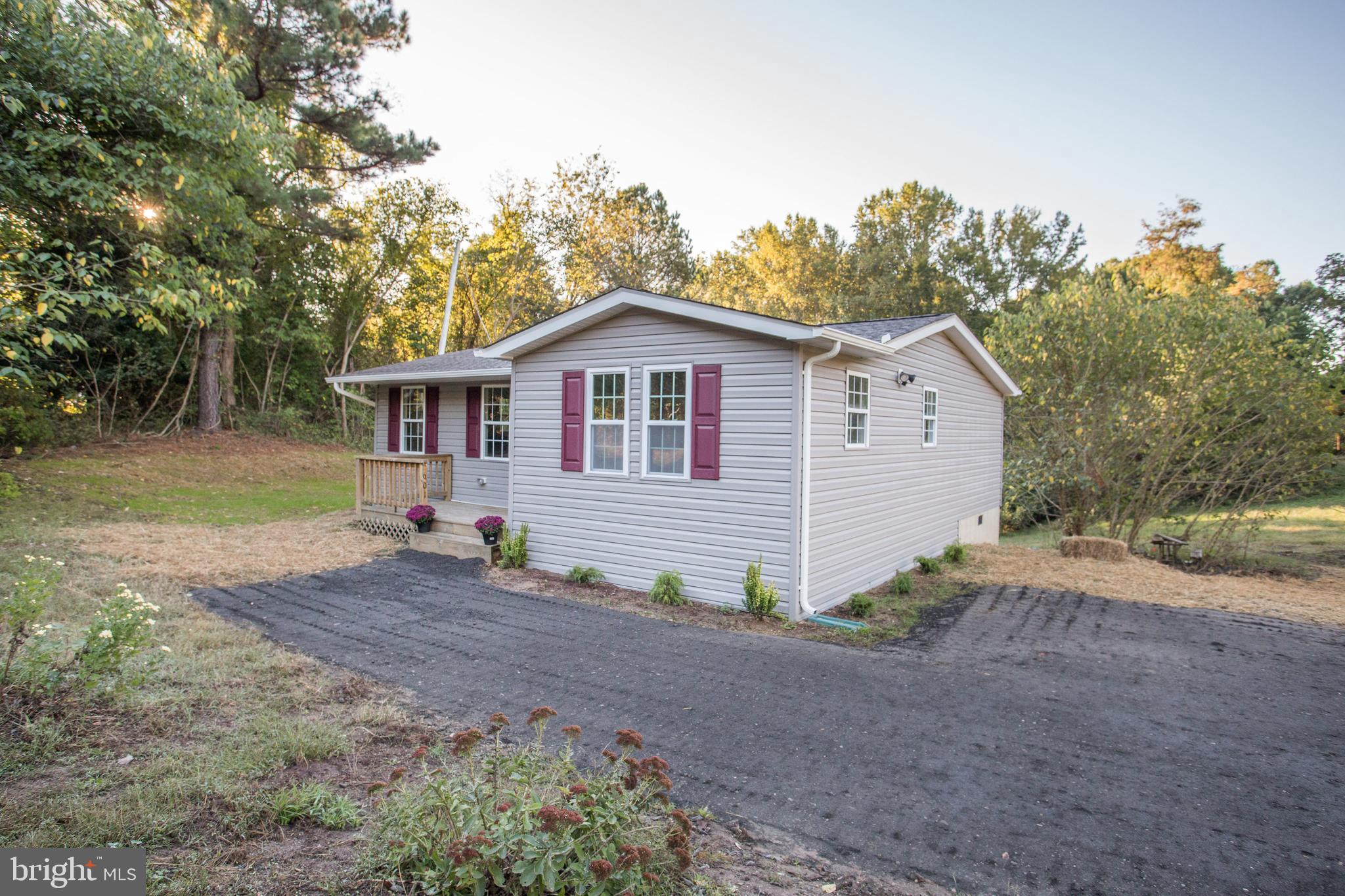 5601 Cherry Hill Road Huntingtown, MD 20639 - Photo 31 of 37 a view of an house with backyard space and garden