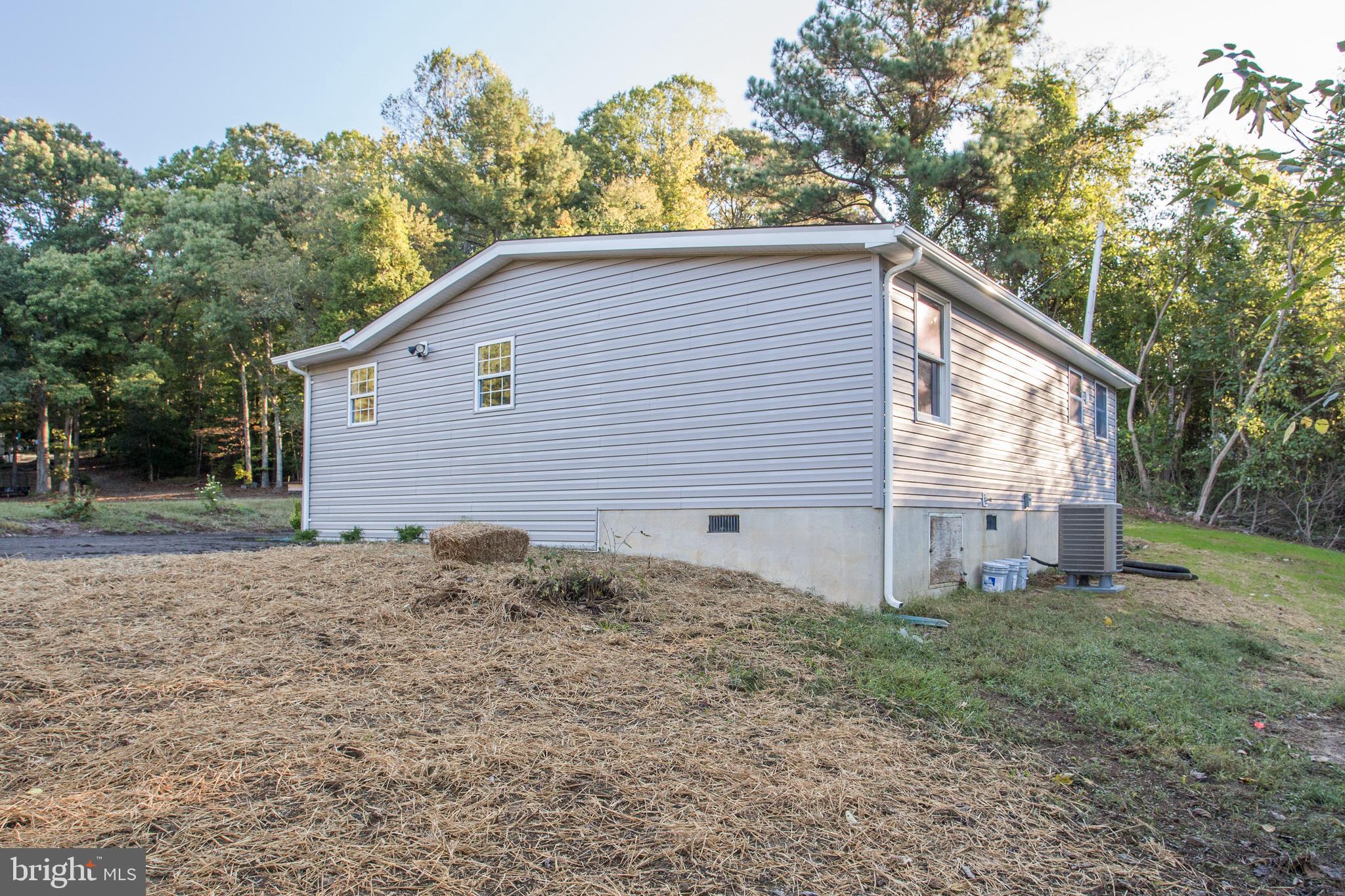 5601 Cherry Hill Road Huntingtown, MD 20639 - Photo 33 of 37 a backyard of a house with lots of green space