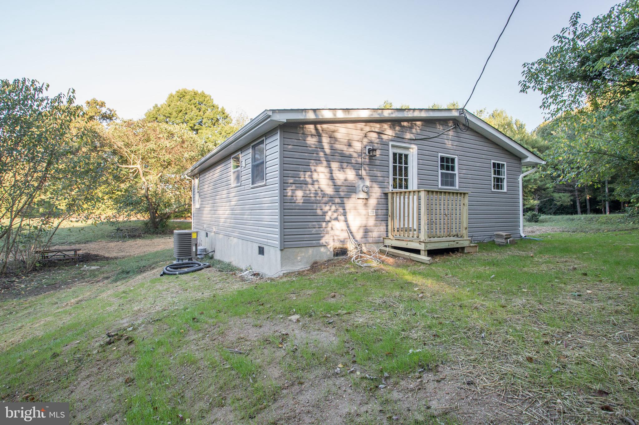 5601 Cherry Hill Road Huntingtown, MD 20639 - Photo 34 of 37 a view of a house with a backyard
