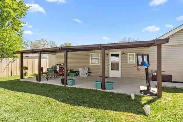 a front view of house with yard and outdoor seating