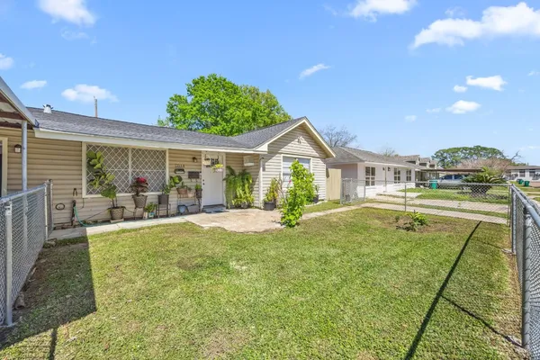 a swimming pool with outdoor seating and yard