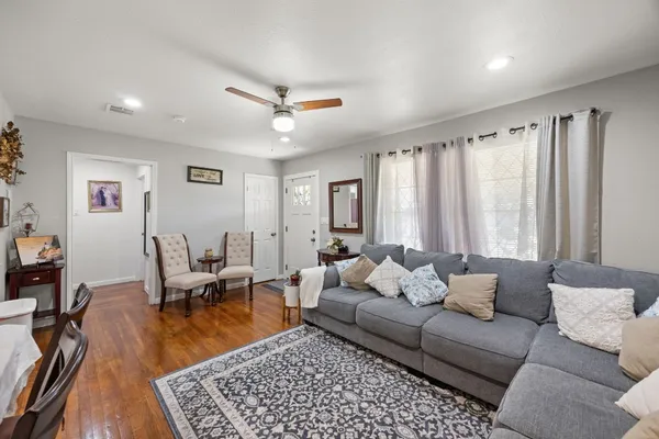a living room with furniture and a rug