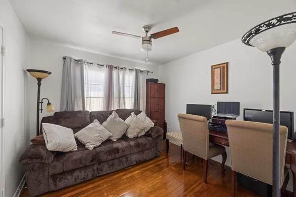 a living room with furniture and a window