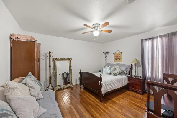 a bedroom with furniture and a chandelier