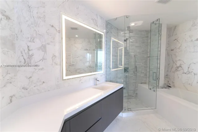 a bathroom with a bathtub and a sink