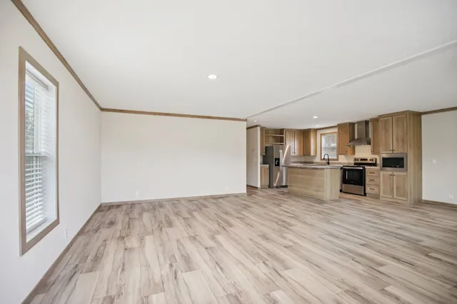 a view of kitchen with microwave and cabinets