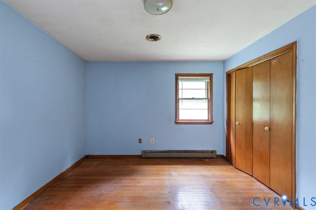 20101 River Road Chesterfield, VA 23838 - Photo 35 of 44 Interior space with blue walls, wood-finish floori