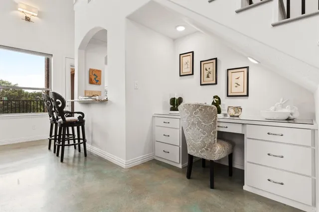 a workspace with a desk chair and painted walls