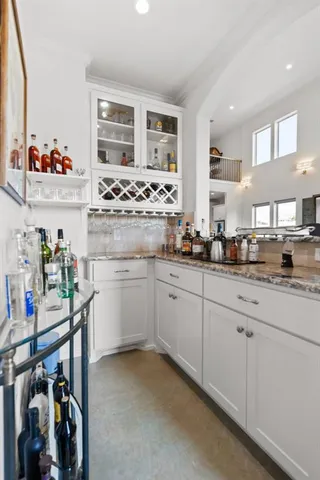 a kitchen with cabinets and window