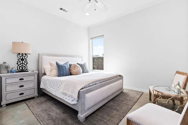 a bedroom with a bed and chair